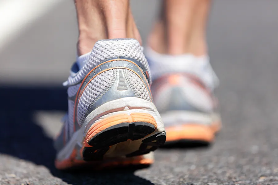Close up of heel and Achilles tendon area, representing pain or strain in the Achilles region