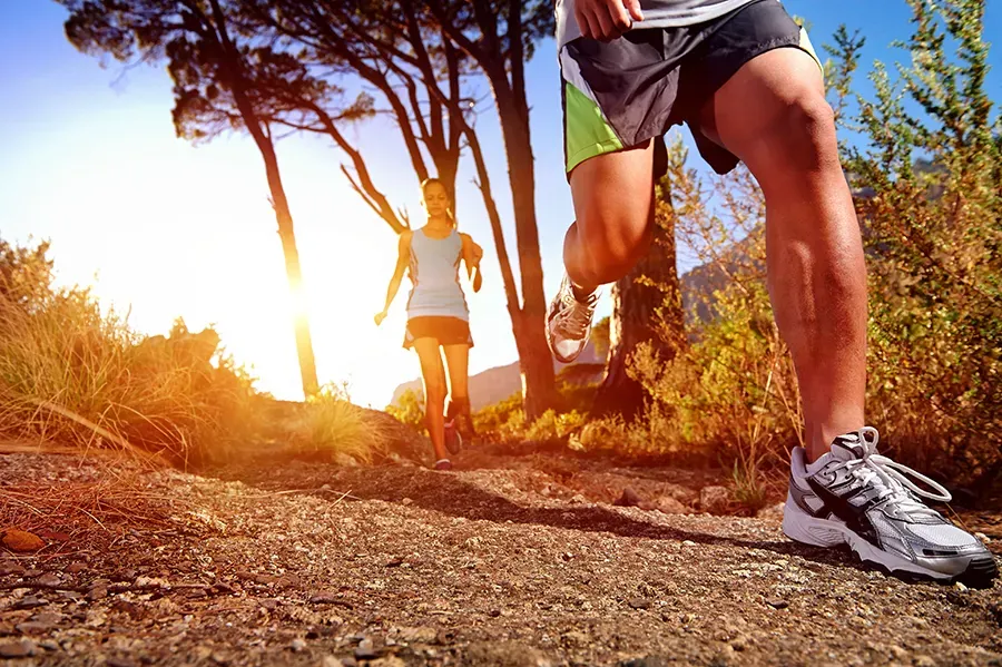 Athletes running on trail during training, representing recovery supported by PRP therapy for muscle and tendon injuries